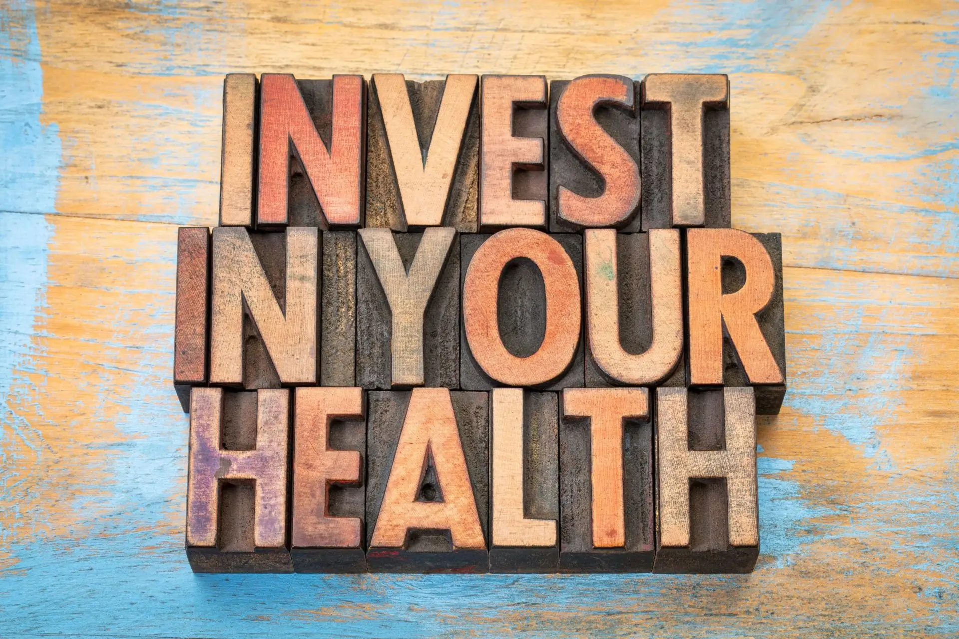 Invest in Your Health" wooden letters.